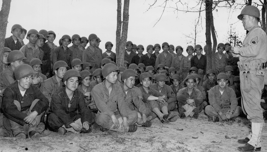 100th Infantry Battalion officers and men in training at Camp Shelby, Louisiana learn from Staff Sergeant Harry Mijamoto on how to effectively use hand grenades, soon after arriving in Camp Shelby, Louisiana, January 1943. (National Archives)