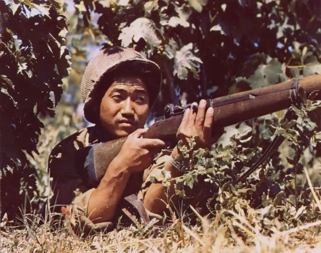 A rifleman of the 100th Infantry Battalion watches out for German snipers in Italy in 1943. (National Archives)