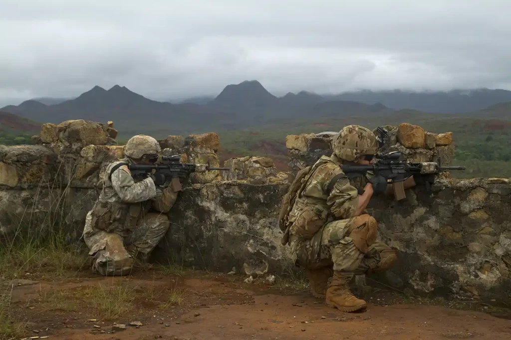 Two soldiers of E Company, 100th Battalion, 442d Infantry Regiment, are seen here during live fire training in Plum, New Caledonia, 15 May 2018. (U.S. Army)