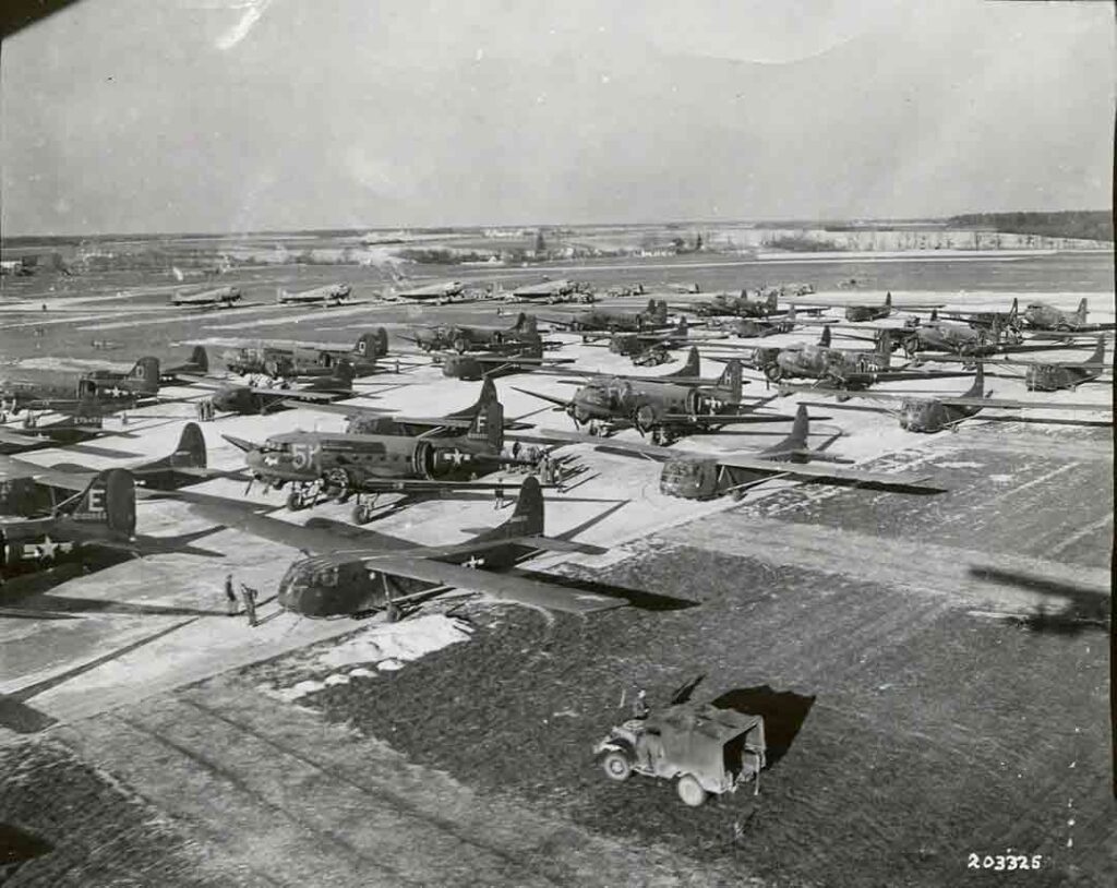 C-47 tow planes and CG-4A gliders line up in a marshaling area at a French airfield to take off for Operation VARSITY, an airborne assault across the Rhine River near Wesel, Germany, 23 March 1945. (National Archives)