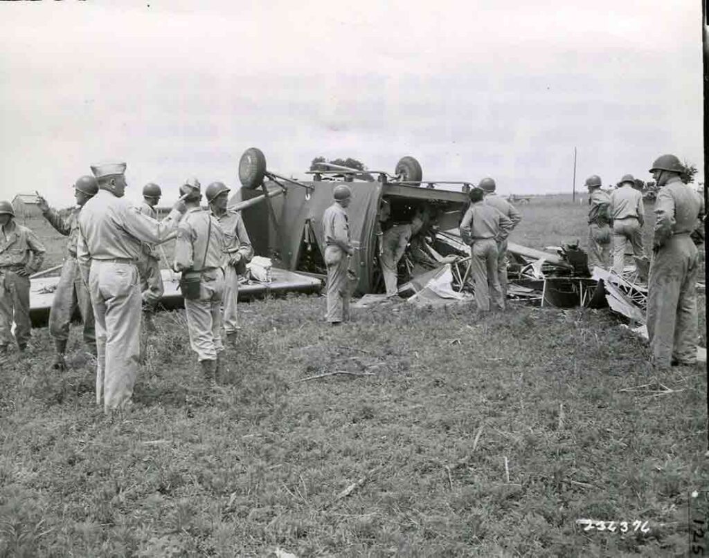 Army officers inspect the wreckage of a CG-4A that crashed during training in Tennessee after the tow rope broke, 4 June 1943. In this case, both pilots parachuted to safety, but in many other glider accidents, the crews were not so fortunate. (National Archives)