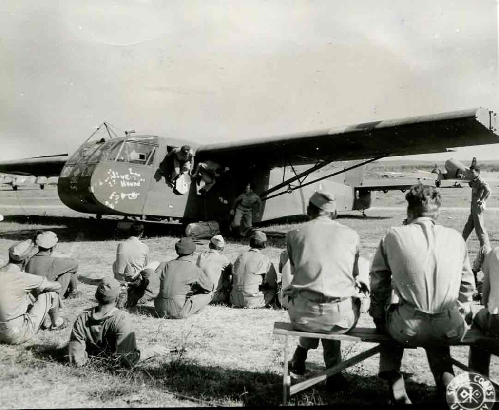 During preparation for Operation DRAGOON, the invasion of southern France, Instructors at Galera Airdrome near Rome, Italy, teach glider pilots how crash out of a glider in case they need to ditch in the Mediterranean Sea, 12 August 1944. (National Archives)