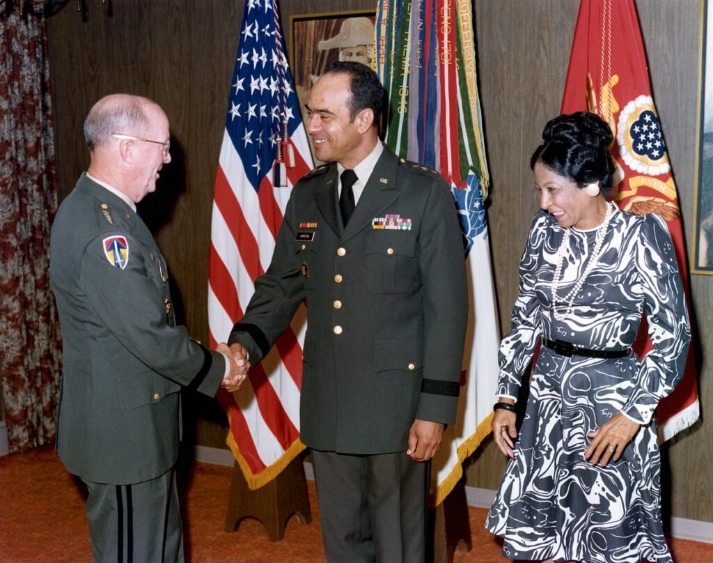 Standing in center next to his wife Charlene McDaniel, LTG Arthur J. Gregg shakes the hand of General Walter T. Kerwin, shortly after Gregg became the first Black officer to be promoted to the rank. (US Army) 