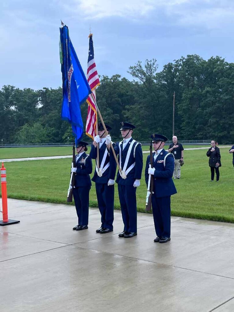 High School students dressed in blue uniforms representing a local Civil Air Patrol Unit present the colors at a local event.
