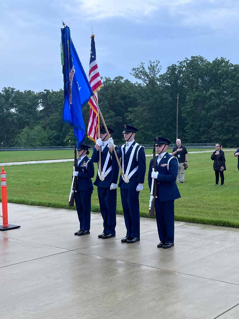 High School students dressed in blue uniforms representing a local Civil Air Patrol Unit present the colors at a local event.